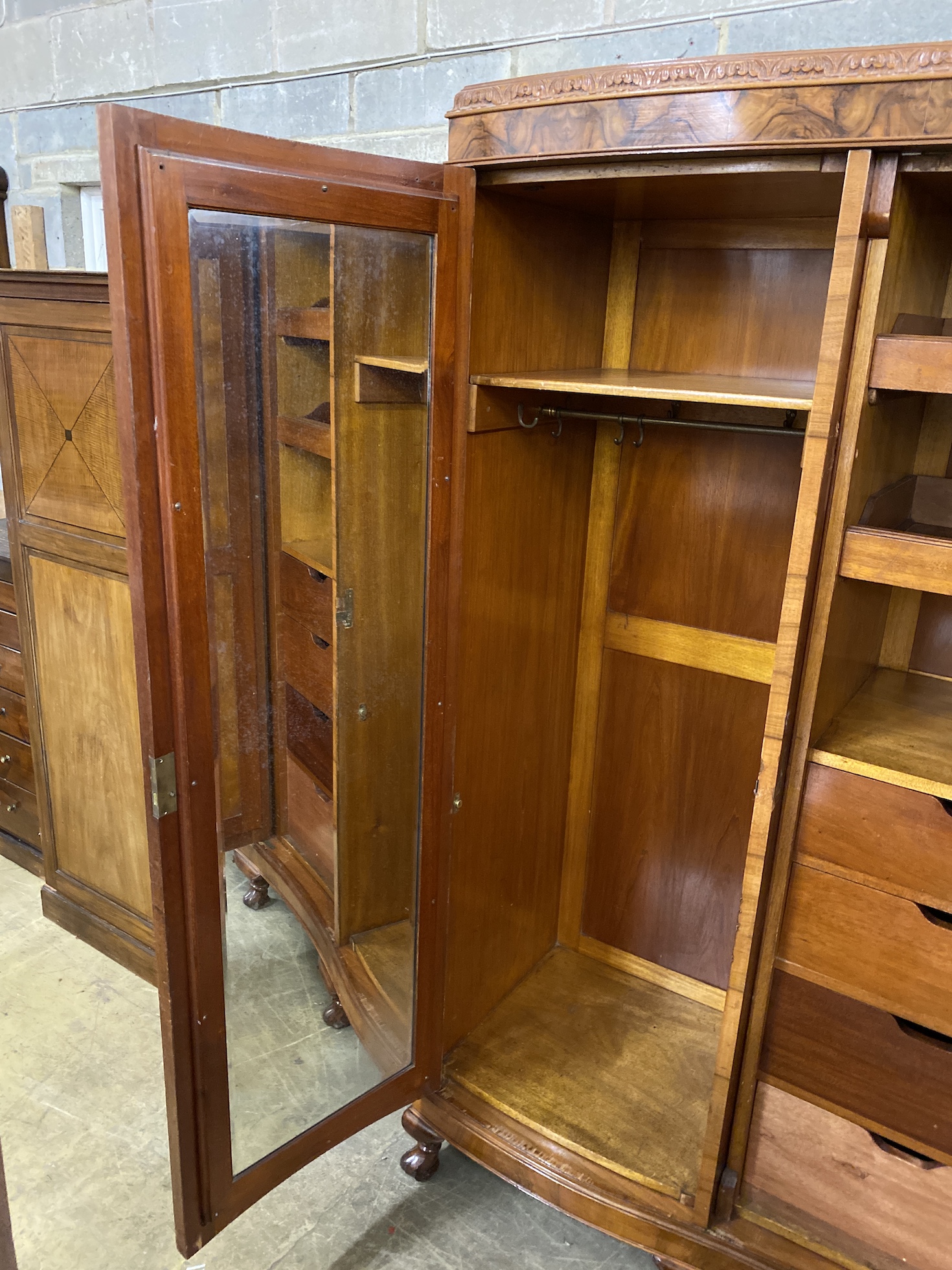 A Queen Anne revival figured walnut triple wardrobe, width 180cm, depth 56cm, height 205cm